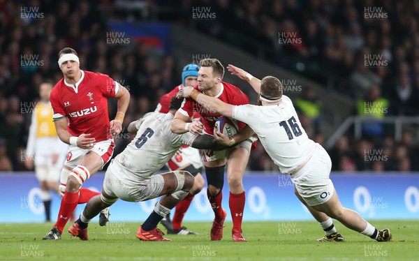 070320 - England v Wales, Guinness Six Nations 2020 - Dan Biggar of Wales is tackled by Courtney Lawes of England and Luke Cowan-Dickie of England