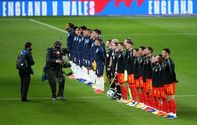 081020 - England v Wales - International Friendly -  Wales and England players line up for the anthems