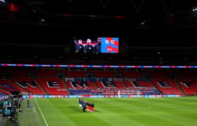 081020 - England v Wales - International Friendly -  Wales and England players line up for the anthems