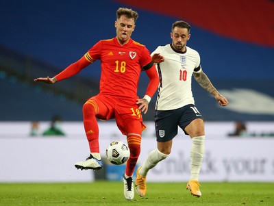 081020 - England v Wales - International Friendly -  Joe Rodon of Wales is challenged by Danny Ings of England