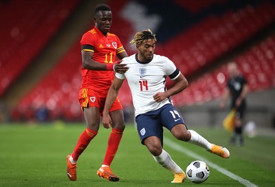 081020 - England v Wales - International Friendly -  Reece James of England is tackled by Rabbi Matondo of Wales