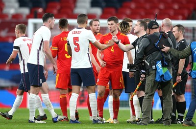 081020 - England v Wales - International Friendly -  Conor Coady of England and Ben Davies of Wales at the end of the game