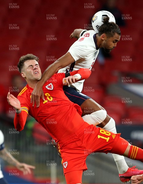 081020 - England v Wales - International Friendly -  Joe Rodon of Wales and Dominic Calvert-Lewin of England compete in the air