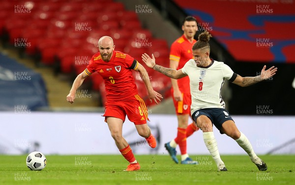 081020 - England v Wales - International Friendly -  Jonny Williams of Wales is tackled by Kalvin Phillips of England