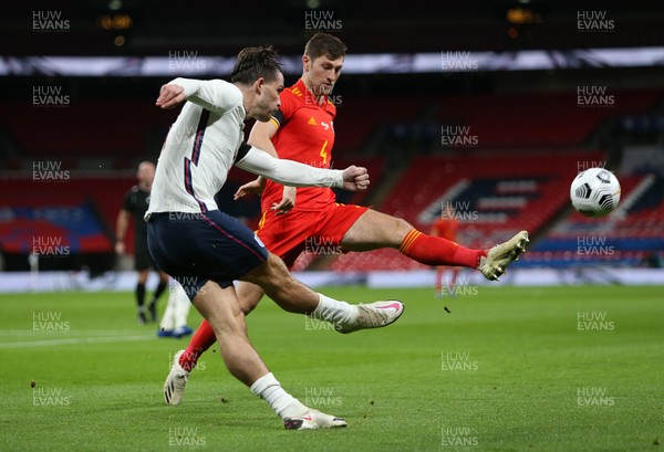 081020 - England v Wales - International Friendly - Jack Grealish of England is challenged by Ben Davies of Wales