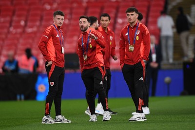 091025 - England v Wales - International Friendly - Nathan Broadhead, Josh Sheehan and Mark Harris of Wales arrive at the stadium to take in their surroundings head of the match