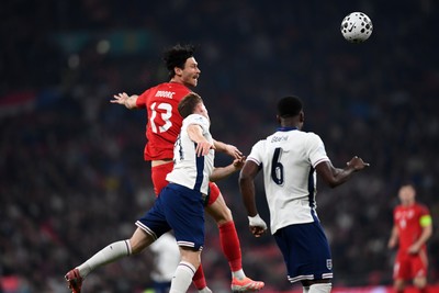 091025 - England v Wales - International Friendly - Kieffer Moore of Wales heads the ball