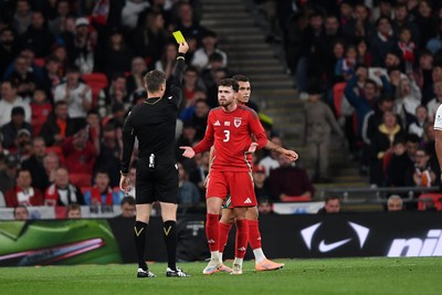 091025 - England v Wales - International Friendly - Neco Williams of Wales receives a yellow card
