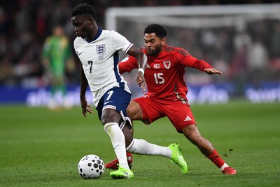 091025 - England v Wales - International Friendly - Bukayo Saka of England is challenged by Jay Dasilva of Wales