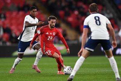 091025 - England v Wales - International Friendly - Josh Sheehan of Wales is challenged by Marcus Rashford of England