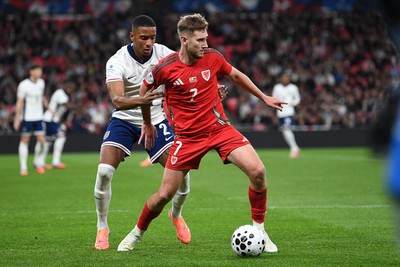 091025 - England v Wales - International Friendly - David Brooks of Wales is challenged by Ezri Konsa of England