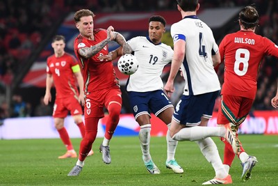 091025 - England v Wales - International Friendly - Joe Rodon of Wales is challenged by Ollie Watkins of England
