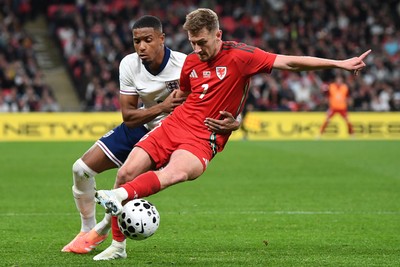 091025 - England v Wales - International Friendly - David Brooks of Wales is challenged by Ezri Konsa of England
