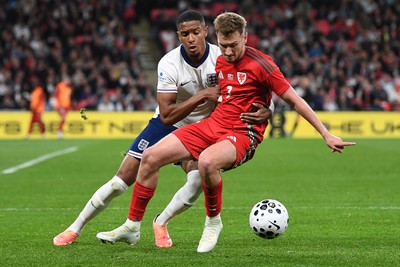 091025 - England v Wales - International Friendly - David Brooks of Wales is challenged by Ezri Konsa of England