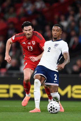 091025 - England v Wales - International Friendly - Kieffer Moore of Wales is challenged by Ezri Konsa of England