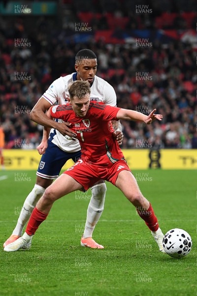 091025 - England v Wales - International Friendly - David Brooks of Wales is challenged by Ezri Konsa of England