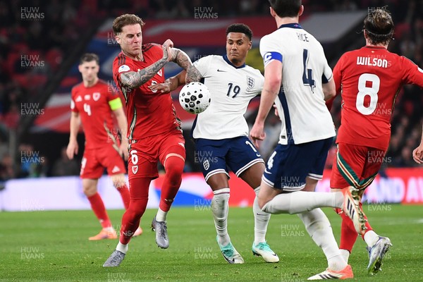 091025 - England v Wales - International Friendly - Joe Rodon of Wales is challenged by Ollie Watkins of England