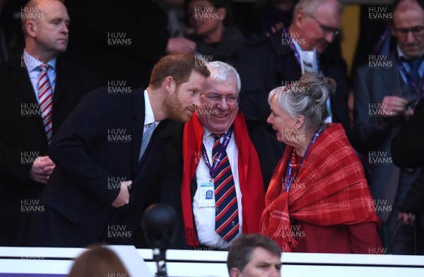 100218 - England v Wales - NatWest 6 Nations - Prince Harry shares a joke with WRU president Dennis Gethin and his wife Janet