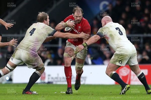 100218 - England v Wales - Natwest 6 Nations - Alun Wyn Jones of Wales is tackled by Joe Launchbury and Dan Cole of England