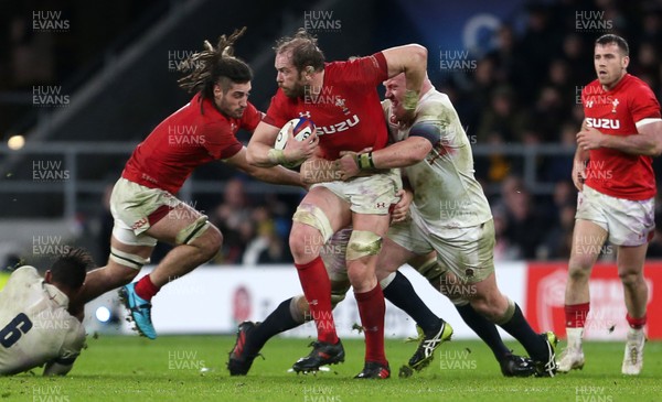 100218 - England v Wales - Natwest 6 Nations - Alun Wyn Jones of Wales is tackled by Joe Launchbury and Dan Cole of England