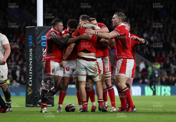 100224 - England v Wales - Guinness 6 Nations - Alex Mann of Wales is jumped on by team mates celebrating his try