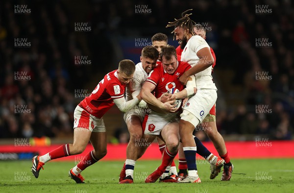 100224 - England v Wales - Guinness 6 Nations - Nick Tompkins of Wales is tackled by Henry Slade of England