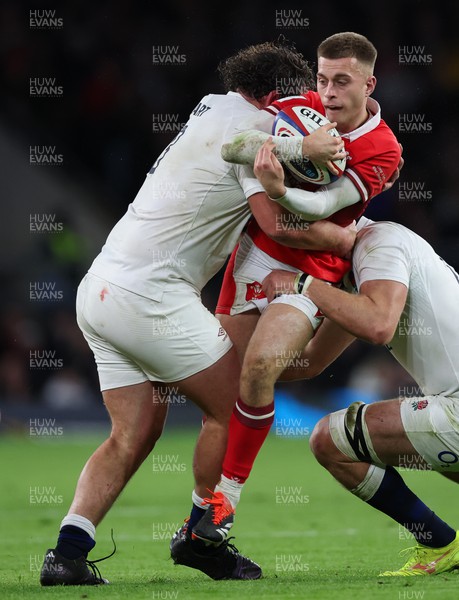 100224 - England v Wales, Guinness 6 Nations 2024 - Cameron Winnett of Wales is tackled by Will Stuart of England’