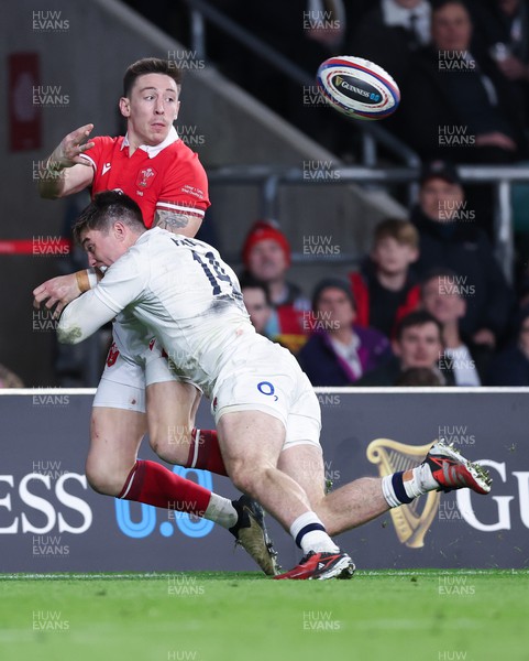 100224 - England v Wales, Guinness 6 Nations 2024 - Josh Adams of Wales is tackled by Tommy Freeman of England