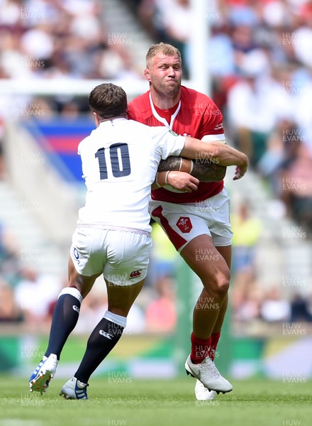110819 - England v Wales - Quilter International - Ross Moriarty of Wales is tackled by George Ford of England