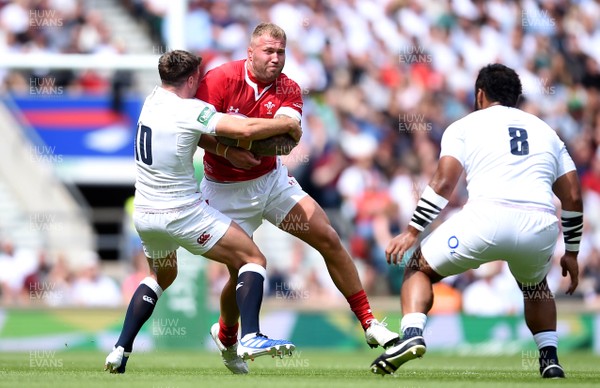 110819 - England v Wales - Quilter International - Ross Moriarty of Wales is tackled by George Ford of England
