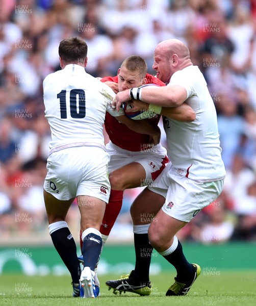 110819 - England v Wales - Quilter International - Liam Williams of Wales is tackled by George Ford and Dan Cole of England