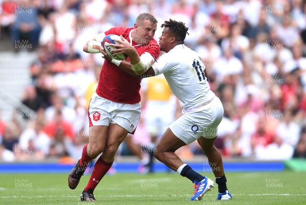 110819 - England v Wales - Quilter International - Hadleigh Parkes of Wales is tackled by Anthony Watson of England
