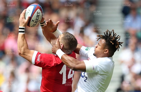 110819 - England v Wales - World Cup Warm Up - Quilter International - George North of Wales is challenged in the air by Anthony Watson of England