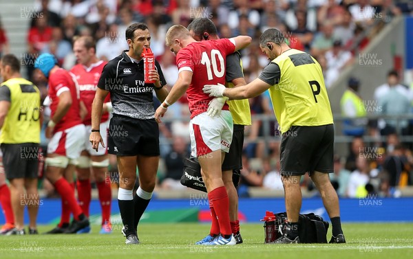 110819 - England v Wales - World Cup Warm Up - Quilter International - Gareth Anscombe of Wales is taken off the field injured, helped by medics