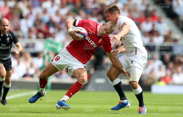 110819 - England v Wales - World Cup Warm Up - Quilter International - Liam Williams of Wales is tackled by Piers Francis of England