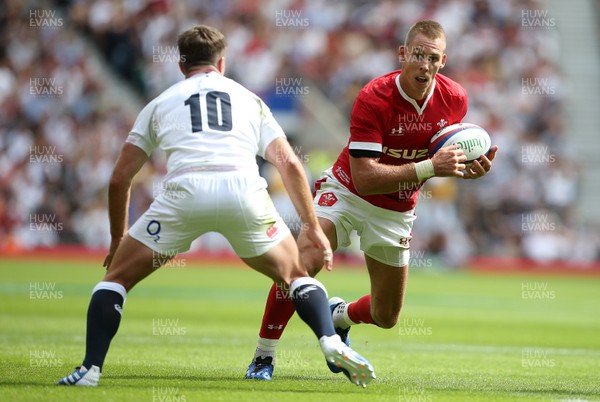 110819 - England v Wales - World Cup Warm Up - Quilter International - Liam Williams of Wales is challenged by George Ford of England