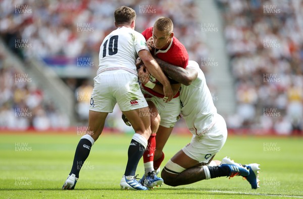 110819 - England v Wales - World Cup Warm Up - Quilter International -Liam Williams of Wales is tackled by George Ford and Courtney Lawes of England