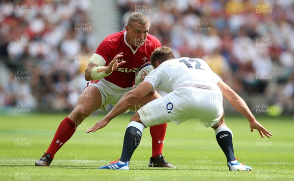 110819 - England v Wales - World Cup Warm Up - Quilter International - Hadleigh Parkes of Wales is tackled by Piers Francis of England