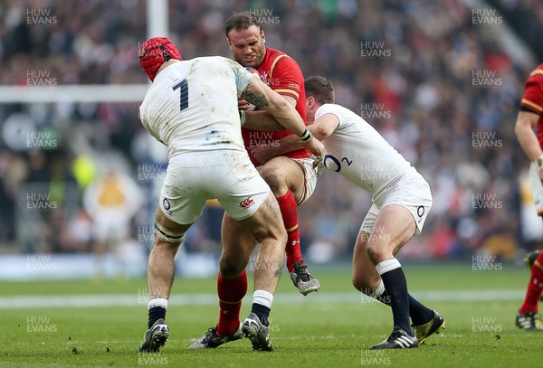 120316 - England v Wales - RBS 6 Nations - Jamie Roberts of Wales is tackled by James Haskell and Owen Farrell of England