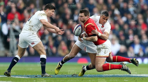 120316 - England v Wales - RBS 6 Nations - Dan Biggar of Wales is tackled by Ben Youngs and Anthony Watson of England