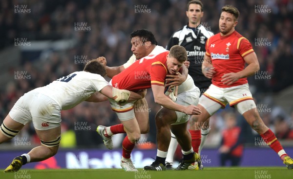 120316 - England v Wales - RBS 6 Nations 2016 -Rhys Priestland of Wales is tackled by Jack Clifford and Mako Vunipola of England