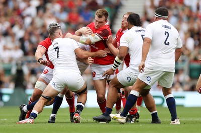 120823 - England v Wales - Summer Nations Series - Nick Tompkins of Wales is tackled by Ben Earl of England 