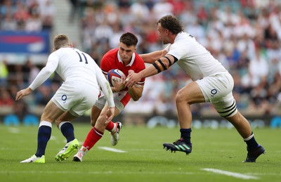 120823 - England v Wales - Summer Nations Series - Joe Roberts of Wales is tackled by Elliot Daly and Will Stuart of England 