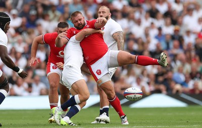 120823 - England v Wales, Summer Nations Series 2023 - Tomas Francis of Wales is held by Jack van Poortvliet of England