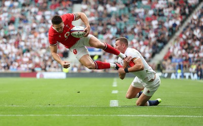 120823 - England v Wales, Summer Nations Series 2023 - Josh Adams of Wales is upended by Freddie Steward of England