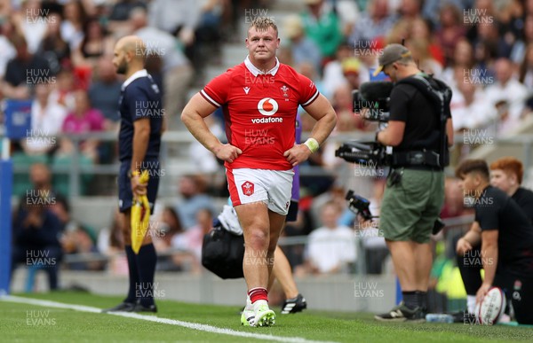 120823 - England v Wales - Summer Nations Series - Dewi Lake of Wales leaves the field injured