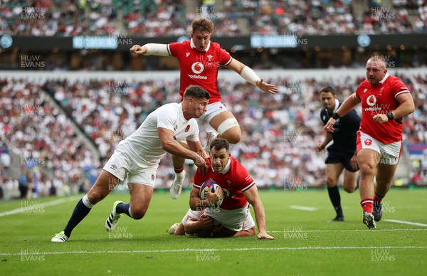 120823 - England v Wales - Summer Nations Series - Tomos Williams of Wales is stopped by Ben Youngs of England 