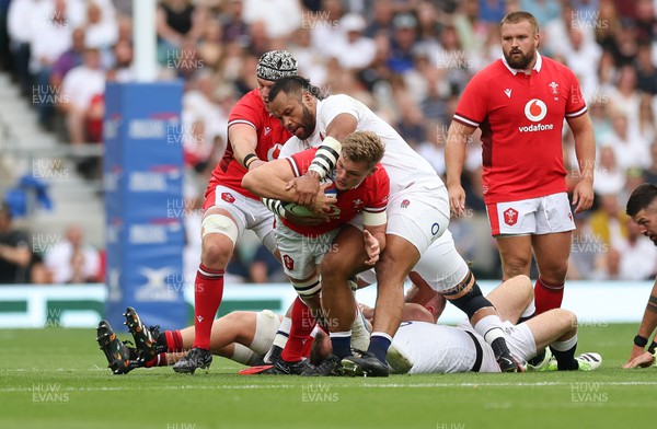 120823 - England v Wales, Summer Nations Series 2023 - Taine Plumtree of Wales is tackled by Billy Vunipola of England