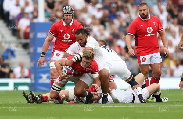 120823 - England v Wales, Summer Nations Series 2023 - Taine Plumtree of Wales is tackled by Billy Vunipola of England