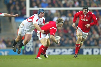 04.02.06.. England v Wales, RBS Six Nations, Twickenham Wales' Matthew Watkins is tackled by Matt Stevens as he looks to offload to Michael Owen 